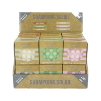 Display case filled with 24 solid shampoos with massage pimples ready for sale
